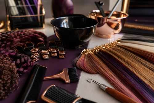 Color and braiding tools arranged for supervised cosmetology student work